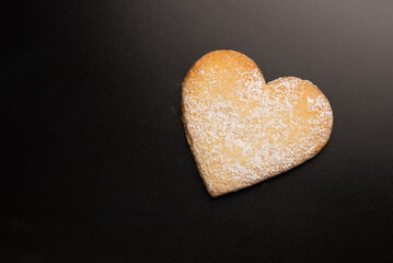 Shortbread in the shape of a heart isolated on white background.