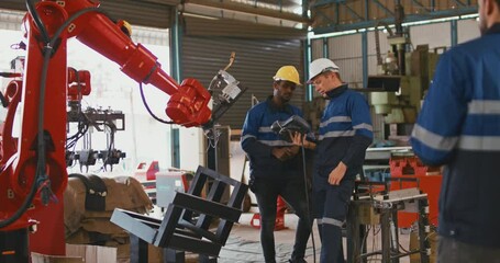 TwEngineer cooperation male and female technician maintenance control relay robot arm system welding with tablet laptop to control quality operate process work heavy industry 4.0 manufacturing factory - Powered by Adobe