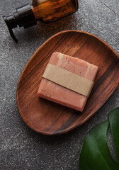 Handmade soap bar and green leaf