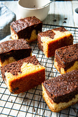 Chocolate marble cake. Slices on tray and wooden table