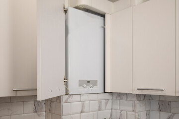 Gas boiler water heater installated in kitchen furniture