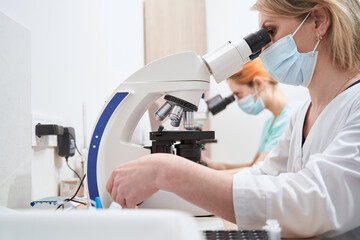 Lab technicians or scientists working in laboratory