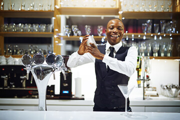 Its time to shake things up in here. Cropped shot of a well-dressed bartender standing behind the counter. - obrazy, fototapety, plakaty