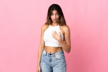 Young caucasian woman isolated on pink background pointing to oneself