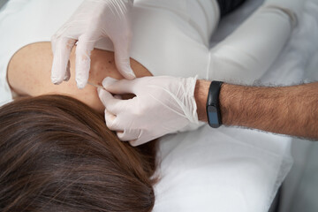 Woman having acupuncture session to relax muscles