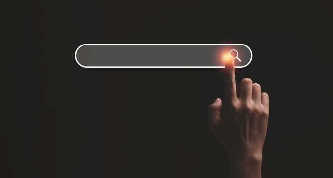 Hand touching with search icon for Search Engine Optimisation or SEO concept to find information by internet connection.