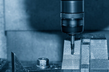 Closeup scene the press die manufacturing process by CNC milling machine with ball end mill tool.