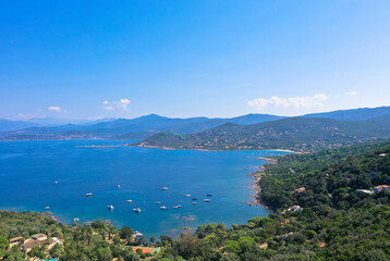 Fototapeta na wymiar Spectacular aerial view of the Golf at Sagone. In the background the mountain village of the same name. Tourism and vacations concept. Corsica, France