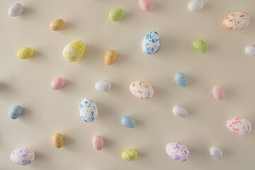Easter and spring concept 2022. Pastel Easter concept with pastel easter eggs .  Easter pastel background. Creative easter arrangement.
