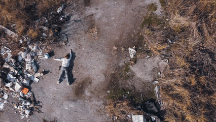 dead body the corpse of a murdered teenage girl found by drone in a garbage dump during aerial...