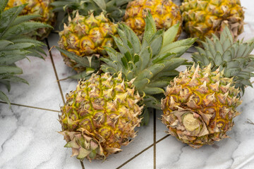 The small ripe yellow pineapples sold at farmers market
