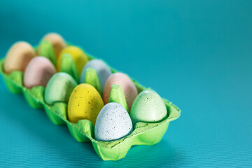 easter eggs in a box on the table close-up, colorful decorations for easter