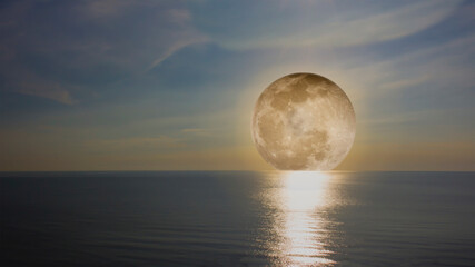 Fototapeta na wymiar Moon over the sea.