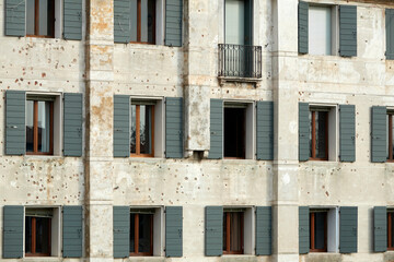 Fototapeta premium Bullet holes in a house facade