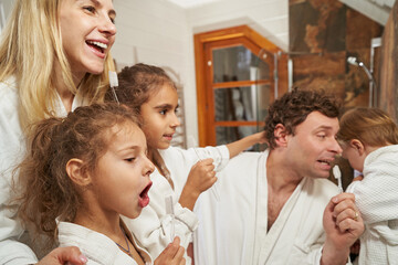 Portrait of parents and children having fun at home