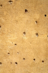 Bullet holes in a house facade