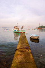 Old harbor with fishing boats in Tuzla. Blue sky and natural white clouds on day time. Small boats waiting for sail. amazing clouds over İstanbul. Blue sky on sunset