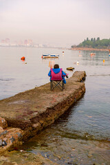 Old harbor with fishing boats in Tuzla. Blue sky and natural white clouds on day time. Small boats waiting for sail. amazing clouds over İstanbul. Blue sky on sunset
