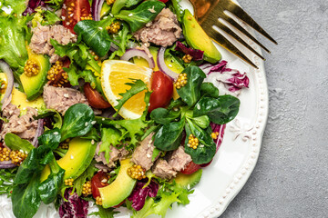 Close up tuna salad with lettuce, cherry tomatoes, avocado and red onions. superfood concept. Healthy, clean eating concept. Vegan or gluten free diet. Top view