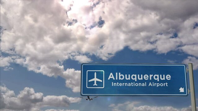 Jet airplane landing in Albuquerque, USA, New Mexico. Plane city arrival with airport direction sign. Travel, business, tourism and plane transport concept.