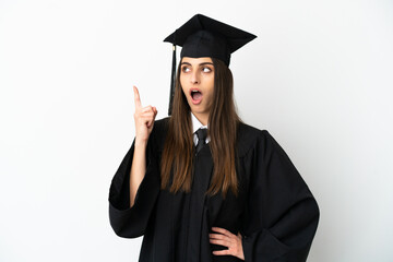 Young university graduate isolated on white background thinking an idea pointing the finger up