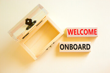 Welcome onboard symbol. Concept words Welcome onboard on wooden blocks on a beautiful white table white background. Empthy wooden chest. Business onboarding and welcome onboard concept, copy space.