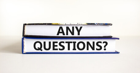 Any questions symbol. Concept words Any questions on books on a beautiful white table white background. Business and Any questions Q and A concept, copy space.