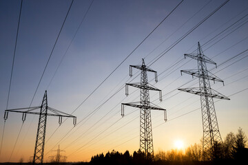 Fototapeta premium high voltage road evening sky silhouettes