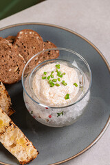 Pike caviar in a glass vase on ice with green onions and croutons. Fish caviar, a delicacy. A gourmet dish. Apetizer.