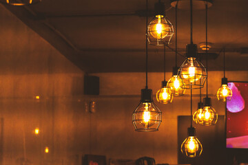 Hanging lamps in loft style indoors.