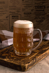 mug of light beer, foamy drink.