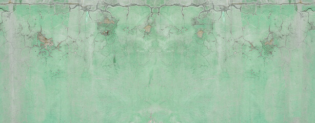 Green wall,abstract background with old green paint texture of plaster and gray cement, panoramic background