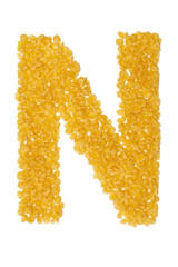 Letter N made from food on a white background
