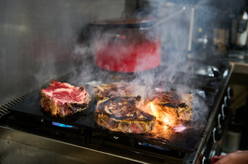 Thick beef steaks on the grill