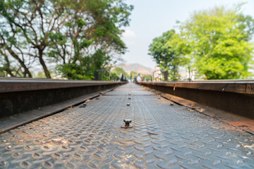 Bottom view historical railway bridge in  at Kanchanaburi, Thailand. Famous place tourist visit in Thailand