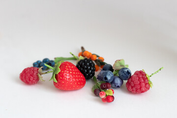 Miniature figures of strawberries, blackberries, raspberries, blueberries, blueberries, cranberries and cranberries