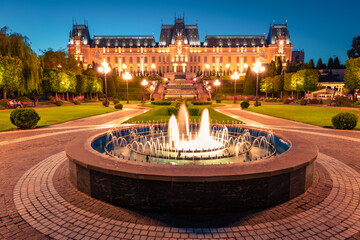 Obraz premium Wonderful evening view of Cultural Palace Iasi. Colorful summer cityscape of Iasi town, capital of Moldavia region, Romania, Europe. Architecture traveling background.