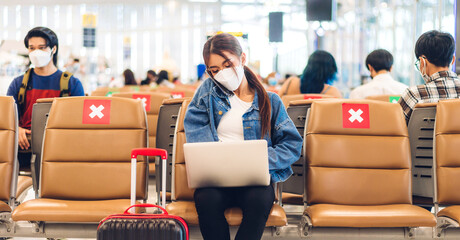 Young woman in quarantine for coronavirus wearing surgical mask face protection during virus...