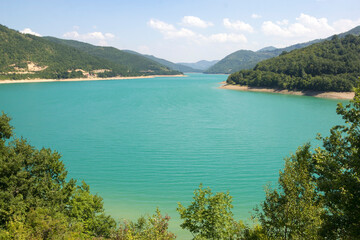 Fototapeta na wymiar A large expanse of emerald-colored lake water