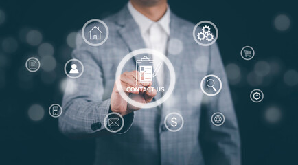 Concept communication and Contact us or Customer support hotline people connect. Business hand touching on virtual screen contact icons, email and address, live chat with internet wifi.