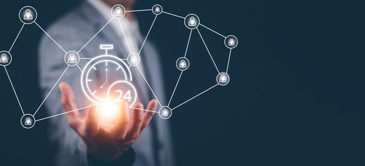 Clock 24h service and people icon Concept, Businessman hand holding clock and line people icon, time management and business work planning, idea and concept of the schedule of the daily routine,