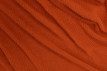 Rudy lub pomarańczowy materiał wełna jako tekstura lub tło na pulpit . Kompozycja dla tekstury.