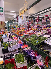 Fresh vegetables and fruits at an indoor produce market, Rome, Italy