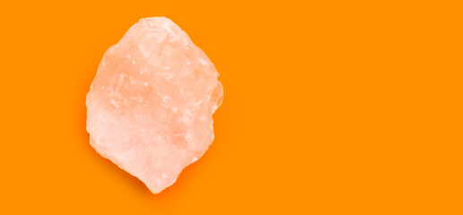 Alum cubes on orange and yellow background, concept for herb, bodycare, skincare, waterclear and protect armpit smell.	