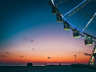 Sunset on the beach of Marseille with a ferris wheel