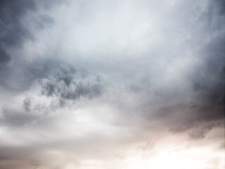 Obraz premium concept of the world after the war. sun rays in the dark stormy sky.a ray in the dark clouds.