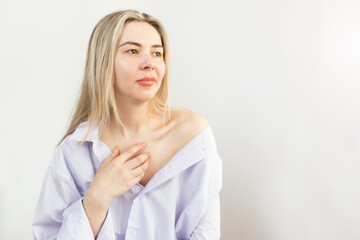 woman in a man's shirt.femininity.female collarbone.
Happiness sensual young woman in a light men's...