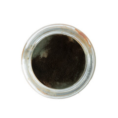 black mold on some products in a glass jar top view.