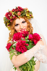 Portrait of a Ukrainian woman with peonies, happiness, joy and delight, delightful facial expressions of jubilation