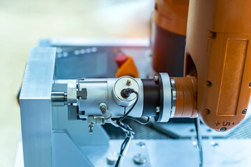 robotic arm catch for electronic assembly line. The robot for smart technology manufacturing process